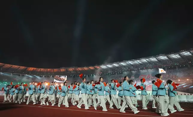 Chinese athletes march into the stadium during the opening ceremony for the Asian Games in Nagoya, Japan, Saturday, Sept. 19, 2026. (AP Photo/Lee Jin-man)