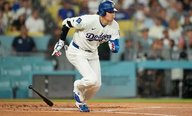 Los Angeles Dodgers' Shohei Ohtani heads to first for a single during the first inning of a baseball game against the San Diego Padres, Wednesday, Sept. 23, 2026, in Los Angeles. (AP Photo/Mark J. Terrill)
