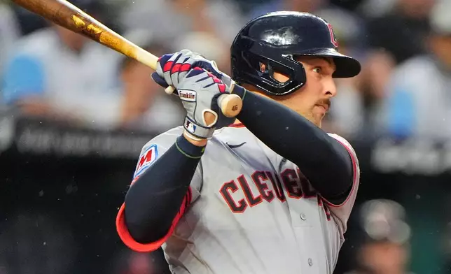 Cleveland Guardians' Nathaniel Lowe watches his sacrifice fly to score a run during the second inning of a baseball game against the Kansas City Royals, Saturday, Sept. 26, 2026, in Kansas City, Mo. (AP Photo/Charlie Riedel)