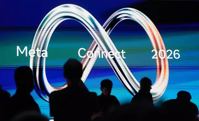 Attendees wait for Meta CEO Mark Zuckerberg's keynote address during the Meta Connect conference, Wednesday, Sept. 23, 2026, in Menlo Park, Calif. (AP Photo/Jeff Chiu)
