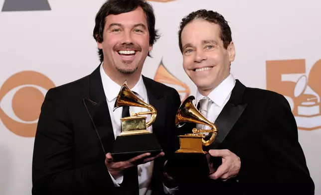 FIE - Duncan Sheik, left, and Steven Sater are seen with the award for best musical show album for "Spring Awakening" at the 50th Annual Grammy Awards on Sunday, Feb. 10, 2008, in Los Angeles. (AP Photo/Mark J. Terrill)