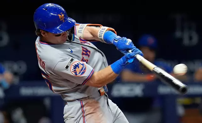 New York Mets' Nick Morabito connects for a three-run double off Tampa Bay Rays pitcher Manuel Rodríguez during the seventh inning of a baseball game Wednesday, Sept. 2, 2026, in St. Petersburg, Fla. (AP Photo/Chris O'Meara)