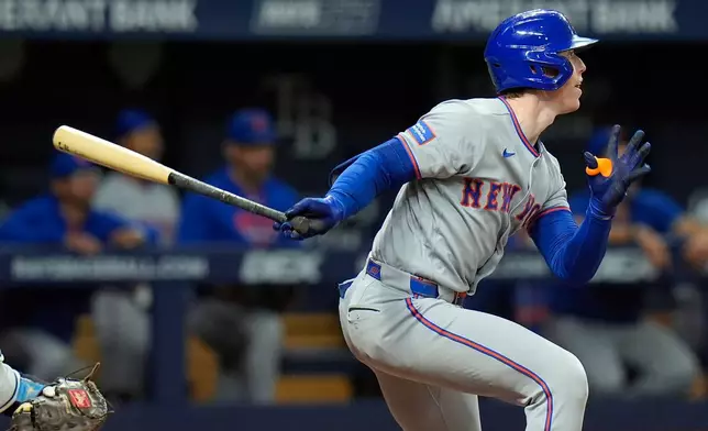 New York Mets' Brett Baty watches his three-run double off Tampa Bay Rays' Griffin Jax during the third inning of a baseball game Wednesday, Sept. 2, 2026, in St. Petersburg, Fla. (AP Photo/Chris O'Meara)