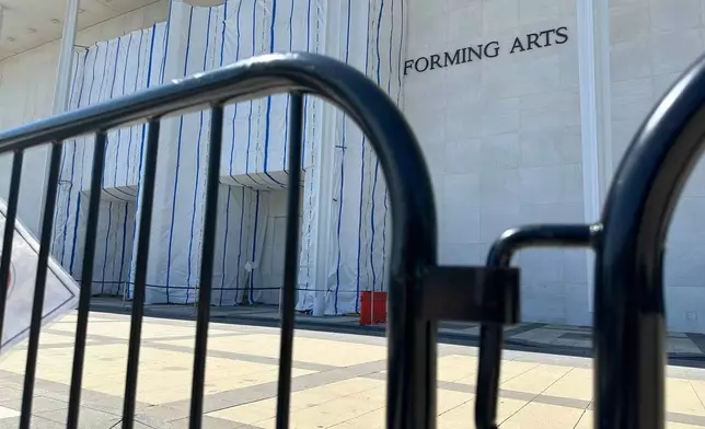 Barriers are placed outside the John F. Kennedy Center for the Performing Arts on Wednesday, Sept. 16, 2026, in Washington. (AP Photo/Nathan Ellgren)
