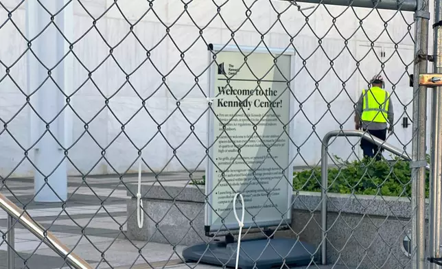 Fencing is placed outside the John F. Kennedy Center for the Performing Arts on Wednesday, Sept. 16, 2026, in Washington. (AP Photo/Nathan Ellgren)
