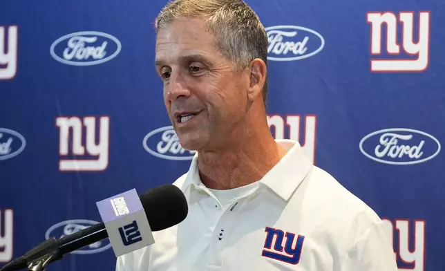 New York Giants head coach John Harbaugh speaks during a press conference after a preseason NFL football game against the Miami Dolphins, Saturday, Aug. 22, 2026, in Miami Gardens, Fla. (AP Photo/Lynne Sladky)