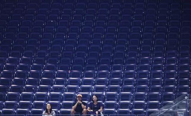 Fans watch Ben Shelton, of the United States, plays against Denis Shapovalov, of Canada, in the fourth set during the third round of the U.S. Open tennis championships, early Saturday, Sept. 5, 2026, in New York. (AP Photo/Adam Hunger)