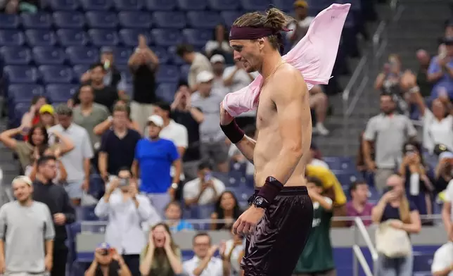 Alexander Zverev, of Germany, celebrates after defeating Quentin Halys, of France, in five sets in the the second round of the U.S. Open tennis championships, early Friday, Sept. 4, 2026, in New York. (AP Photo/Frank Franklin II)