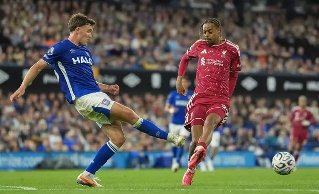 Ipswich Town's Dara O'Shea, left, kicks the ball ahead of Liverpool's Bradley Barcola during the English Premier League soccer match between Ipswich Town and Liverpool in Ipswich, England, Friday, Sept. 4, 2026. (AP Photo/Dave Shopland)