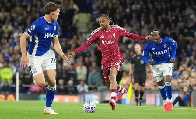 Liverpool's Bradley Barcola, centre, controls the ball during the English Premier League soccer match between Ipswich Town and Liverpool in Ipswich, England, Friday, Sept. 4, 2026. (AP Photo/Dave Shopland)