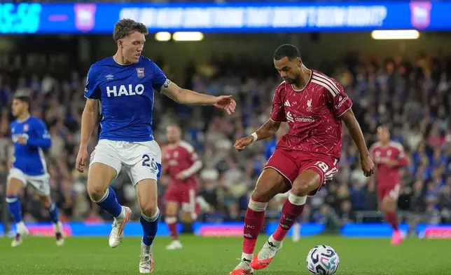 Ipswich Town's Dara O'Shea, left, challenges for the ball with Liverpool's Cody Gakpo during the English Premier League soccer match between Ipswich Town and Liverpool in Ipswich, England, Friday, Sept. 4, 2026. (AP Photo/Dave Shopland)