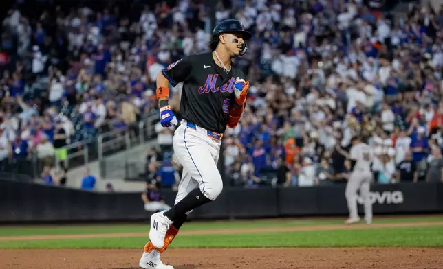 New York Mets' Mark Vientos runs after hitting a three-run home run during the first inning of a baseball game against the San Francisco Giants, Friday, Sept. 4, 2026, in New York. (AP Photo/Angelina Katsanis)