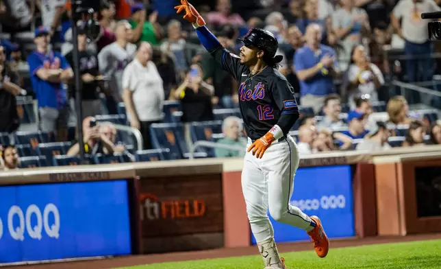 New York Mets Francisco Lindor (12) celebrates after hitting a two-run home run during the sixth inning of a baseball game against the San Francisco Giants, Friday, Sept. 4, 2026, in New York. (AP Photo/Angelina Katsanis)