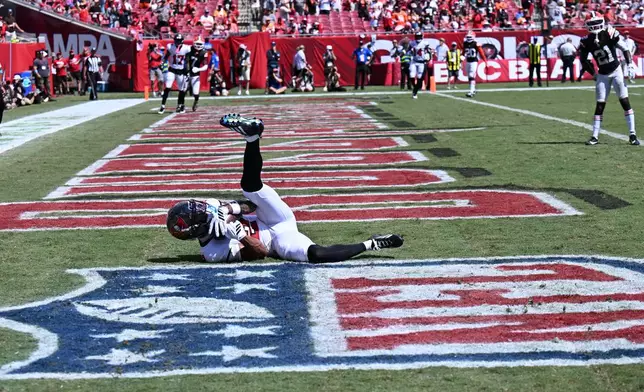 Tampa Bay Buccaneers wide receiver Emeka Egbuka (2) scores a touchdown during the second half of an NFL football game against the Cleveland Browns in Tampa, Fla., Sunday, Sept. 20, 2026. (AP Photo/Jason Behnken)