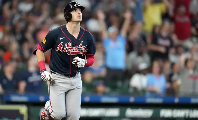 Atlanta Braves' Mike Yastrzemski reacts after hitting a three-run home run off Houston Astros relief pitcher Bryan King during the sixth inning of a baseball game, Sunday, Sept. 20, 2026, in Houston. (AP Photo/Karen Warren)
