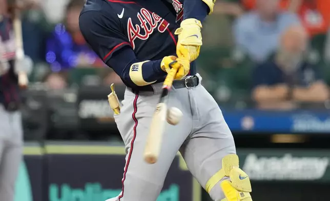 Atlanta Braves' Ronald Acuna Jr. singles off Houston Astros starting pitcher Hunter Brown in the fifth inning of a baseball game, Sunday, Sept. 20, 2026, in Houston. (AP Photo/Karen Warren)