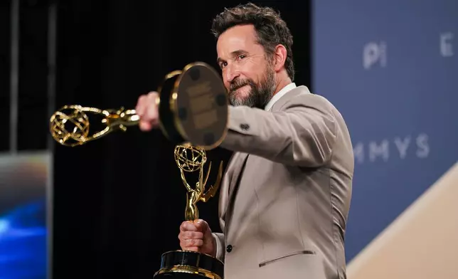 Noah Wyle poses in the press room with the awards for outstanding lead actor in a drama series for "The Pitt" and outstanding drama series for "The Pitt" during the 78th Emmy Awards on Monday, Sept. 14, 2026, at the JW Marriott in Los Angeles. (Photo by Richard Shotwell/Invision/AP)