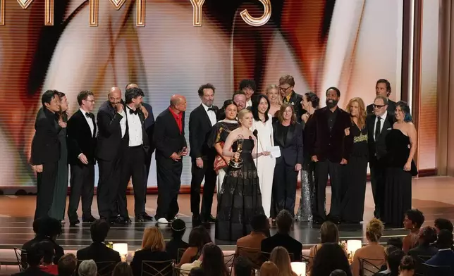 Katie Dippold, center, and the team from "Widow's Bay" accept the award for outstanding comedy series during the 78th Emmy Awards on Monday, Sept. 14, 2026, at the Peacock Theater in Los Angeles. (AP Photo/Chris Pizzello)