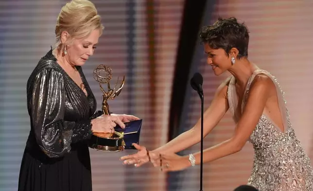 Zendaya, right, presents the award for outstanding lead actress in comedy series to Jean Smart, left, for "Hacks" during the 78th Emmy Awards on Monday, Sept. 14, 2026, at the Peacock Theater in Los Angeles. (AP Photo/Chris Pizzello)