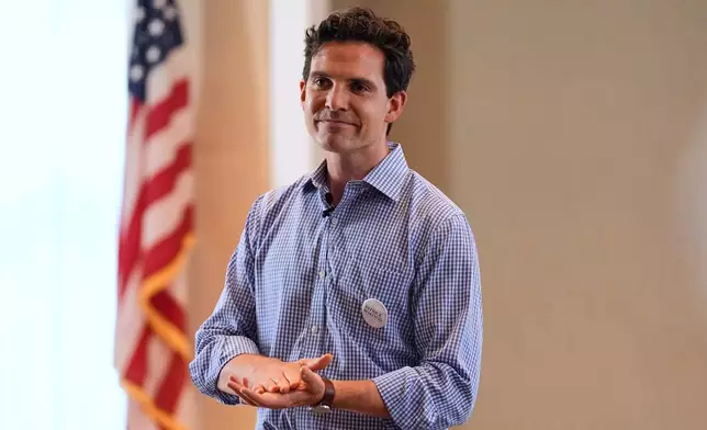 Patrick Roath, a Democrat candidate challenging U.S. Rep. Stephen Lynch (D-Mass.) in the 8th Congressional District, talks with residents at a retirement community, Wednesday, Aug. 26, 2026, in Westwood, Mass. (AP Photo/Charles Krupa)