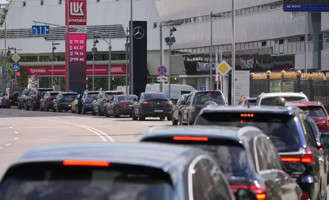 FILE - Motorists line up at a Lukoil gas station in Moscow on Tuesday, June 30, 2026. (AP Photo/Pavel Bednyakov, File)