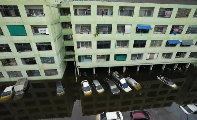 The streets are flooded after a heavy rain, in Bangkok, Thailand, Monday, Sept. 28, 2026. (AP Photo/Sakchai Lalit)