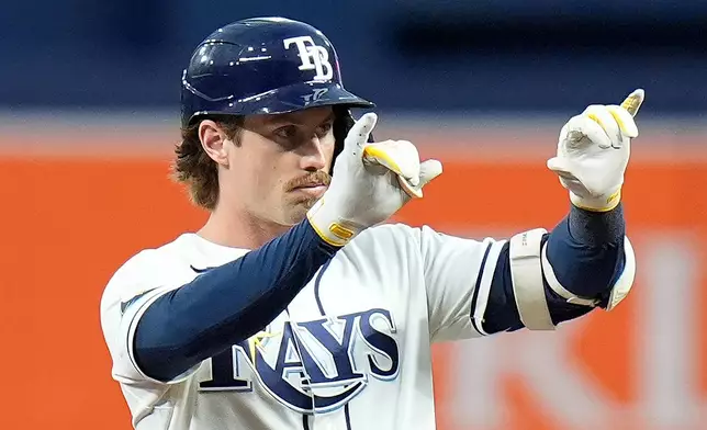 Tampa Bay Rays' Jonny DeLuca celebrates his RBI double off Athletics pitcher Brady Basso during the first inning of a baseball game Wednesday, Sept. 16, 2026, in St. Petersburg, Fla. (AP Photo/Chris O'Meara)