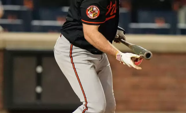 Baltimore Orioles' Pete Alonso looks after his solo home run during the ninth inning of a baseball game against the New York Mets, Tuesday, Sept. 15, 2026, in New York. (AP Photo/Seth Wenig)