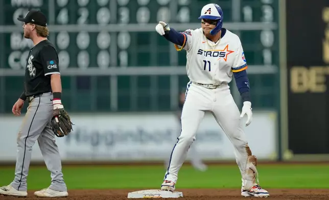 Houston Astros' Cam Smith celebrates after hitting a two-run double against the Chicago White Sox during the fifth inning of a baseball game Monday, Aug. 31, 2026, in Houston. (AP Photo/David J. Phillip)