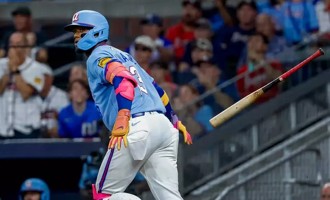 Atlanta Braves' Ronald Acuña Jr. (13) flips his bat after hitting a solo home run against the Philadelphia Phillies during the fourth inning of a baseball game, Saturday, Sept. 12, 2026, in Atlanta. (AP Photo/Erik S. Lesser)