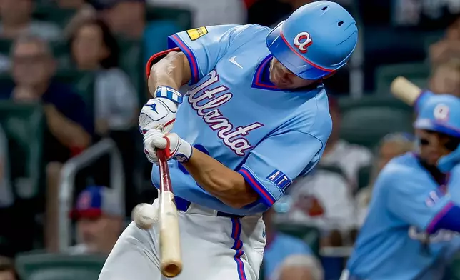 Atlanta Braves designated hitter Drake Baldwin hits a two-run double against the Philadelphia Phillies during the fourth inning of a baseball game, Saturday, Sept. 12, 2026, in Atlanta. (AP Photo/Erik S. Lesser)