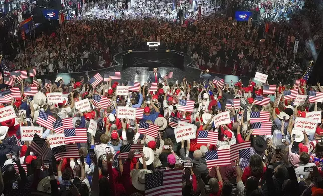 President Donald Trump, center, greets the audience at the Republican convention Thursday, Sept. 10, 2026, in Dallas. (AP Photo/Julio Cortez)