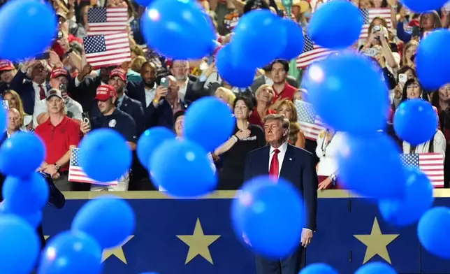 President Donald Trump watches as balloons fall at the Republican convention Thursday, Sept. 10, 2026, in Dallas. (AP Photo/Alex Brandon)