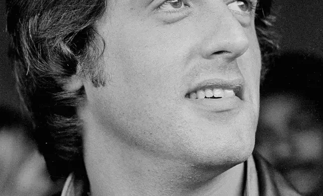 FILE - Sylvester Stallone appears at Veterans Stadium prior to a Philadelphia Phillies' home game to promote his film "Rocky II" on June 14, 1979. (AP Photo/Gene Puskar, File)