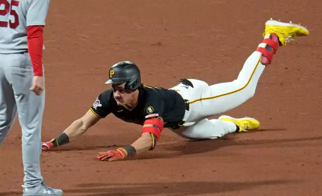 Pittsburgh Pirates' Konnor Griffin slides into third with a triple off St. Louis Cardinals pitcher Andre Pallante during the fifth inning of a baseball game in Pittsburgh, Tuesday, Sept. 22, 2026. (AP Photo/Gene J. Puskar)