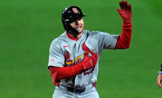 St. Louis Cardinals' Nathan Church celebrates as he stands on second base after hitting a double off Pittsburgh Pirates pitcher Jared Jones during the sixth inning of a baseball game in Pittsburgh, Tuesday, Sept. 22, 2026. (AP Photo/Gene J. Puskar)