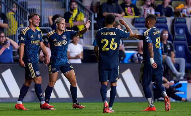 Philadelphia Union's Cavan Sullivan, second from left, celebrates after his goal with Nathan Harriel (26), Jesus Bueno (8) and Kai Wagner, left, during the second half of an MLS soccer match against CF Montreal, Saturday, Sept. 5, 2026, in Chester, Pa. (AP Photo/Chris Szagola)