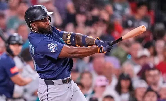 Seattle Mariners' Randy Arozarena watches his RBI single during the fifth inning of a baseball game against the Boston Red Sox, Monday, Aug. 31, 2026, in Boston. (AP Photo/Charles Krupa)