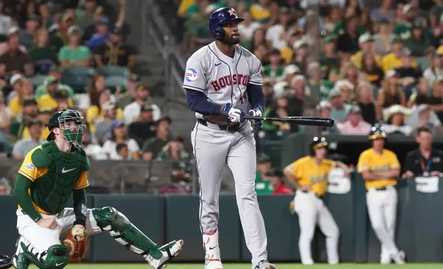 Houston Astros' Yordan Alvarez watches the ball after hitting a three-run home run during the fifth inning of a baseball game against the Athletics Saturday, Sept. 26, 2026, in West Sacramento, Calif. (AP Photo/Sara Nevis)