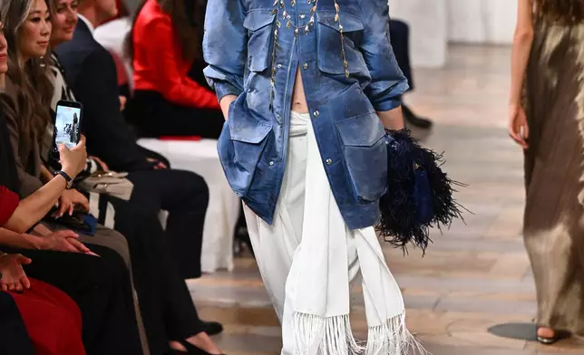 A model walks the runway during the Ralph Lauren Spring/Summer 2027 presentation as part of New York Fashion Week on Wednesday, Sept. 9, 2026, in New York. (Photo by Evan Agostini/Invision/AP)