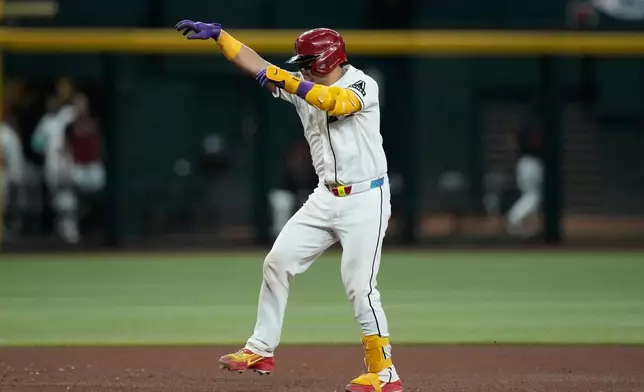 Arizona Diamondbacks' Gabriel Moreno rounds the bases after hitting a home run against the Miami Marlins during the fifth inning of a baseball game, Wednesday, Sept. 16, 2026, in Phoenix. (AP Photo/Ross D. Franklin)