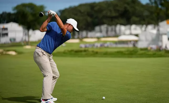 USA teams' Collin Morikawa hits from the third tee against the International team during the first round four-ball match at the Presidents Cup golf tournament at Medinah Country Club, Thursday, Sept. 24, 2026, in Medinah, Ill. (AP Photo/Chris Carlson)