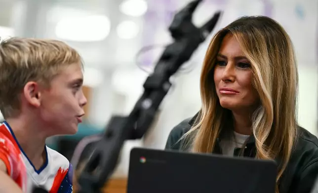 First Lady Melania Trump meets with a student at Mountain View Elementary School in Jefferson, N.C., Tuesday, Sept. 15, 2026. (Kent Nishimura/Pool Photo via AP)
