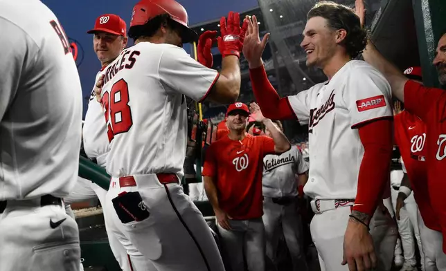 Washington Nationals' Yohandy Morales (28) celebrates his home run with Brady House, right, during the third inning of a baseball game against the Atlanta Braves, Tuesday, Sept. 1, 2026, in Washington. (AP Photo/Nick Wass)