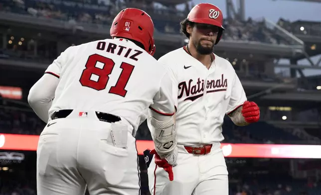 Washington Nationals' Yohandy Morales, right, celebrates his home run with Abimelec Ortiz (81) during the third inning of a baseball game against the Atlanta Braves, Tuesday, Sept. 1, 2026, in Washington. (AP Photo/Nick Wass)