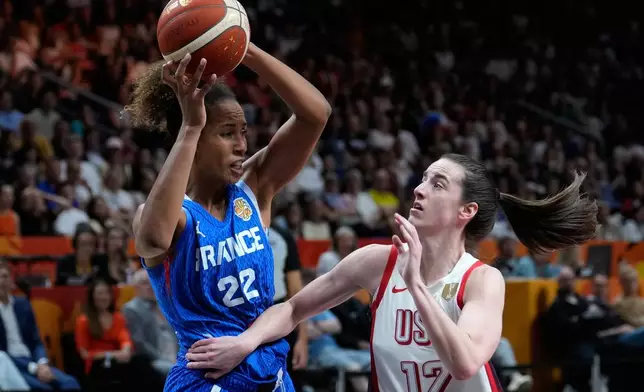 Caitlin Clark of the United States, guards France's Marieme Badiane during the Women's Basketball World Cup final match between the United States and France in Berlin, Sunday, Sept. 13, 2026. (AP Photo/Ebrahim Noroozi)