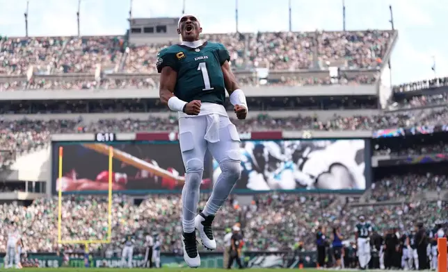 Philadelphia Eagles quarterback Jalen Hurts (1) takes the field for an NFL football game against the Washington Commanders, Sunday, Sept. 13, 2026, in Philadelphia. (AP Photo/Matt Rourke)