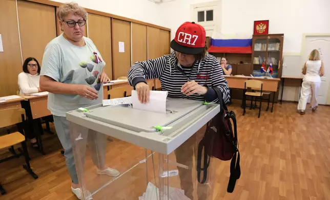A voter casts a ballot in the parliamentary election in Vladivostok, Russia, Friday, Sept. 18, 2026. (AP Photo)