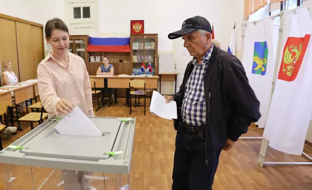Voters cast their ballot for the parliamentary election in Vladivostok, Russia, Friday, Sept. 18, 2026. (AP Photo)
