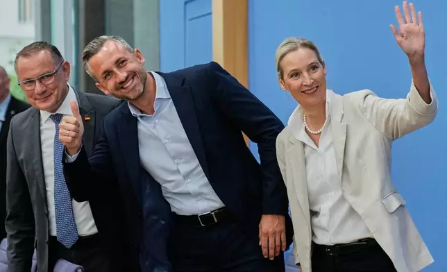 Co-leaders of Alternative for Germany party, or AfD, Alice Weidel, right, and Tino Chrupalla, left, and top candidate for the Saxony-Anhalt state elections Ulrich Siegmund, center, attend a press conference in Berlin, Germany, Monday, Sept. 7, 2026. (AP Photo/Ebrahim Noroozi)